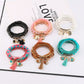 Lovra metal tassel pendant beaded bracelet displayed on a white background