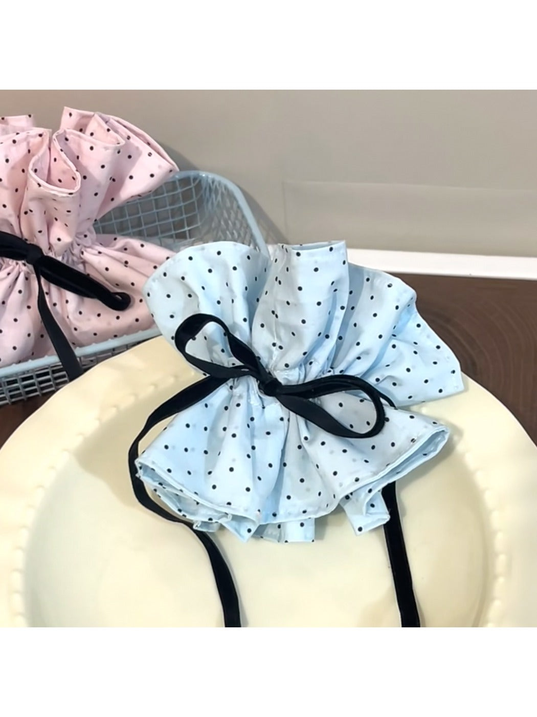 Gifty polka dot bow scrunchie displayed on a white background showing full bow detail