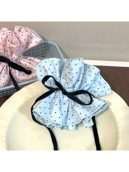 Gifty polka dot bow scrunchie displayed on a white background showing full bow detail