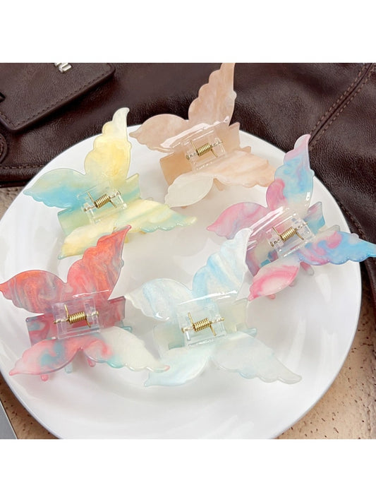 Beau gradient butterfly shaped hair claw clip on white background