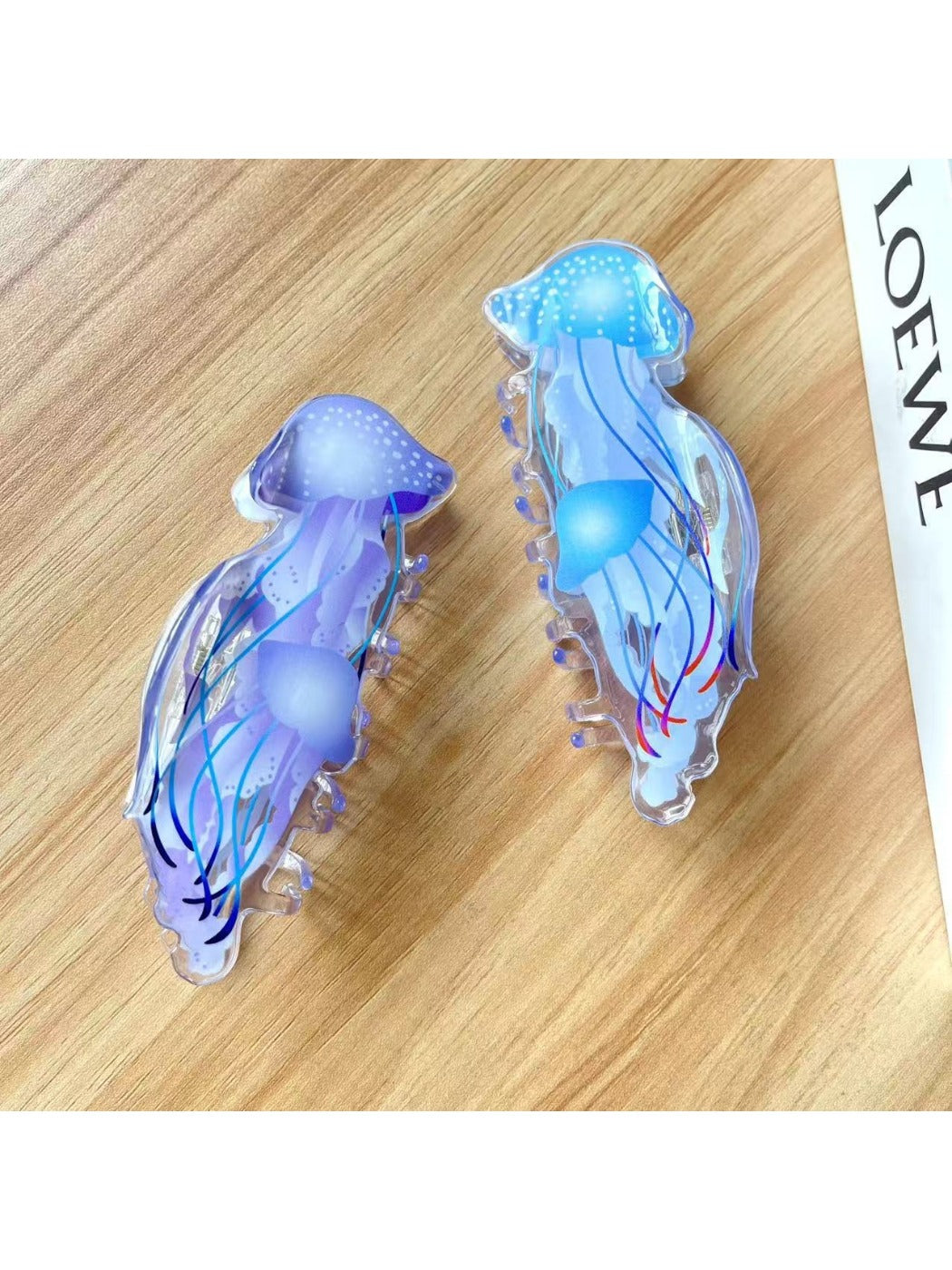 Beau jellyfish shaped claw clip in translucent pastel colors on white background