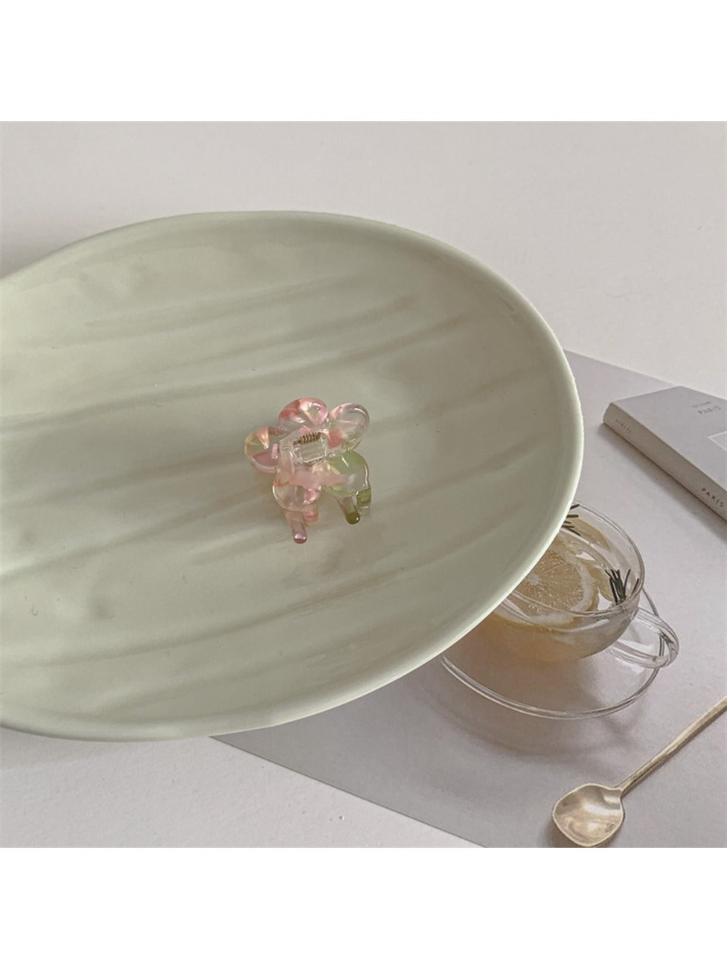Beau flower shaped small claw clip shown from top angle highlighting petals