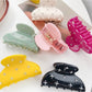 Close-up of Beau crescent hair claw clip showing curved design and matte finish