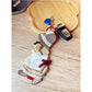 Keypus keychain alongside other small accessories for lifestyle context
