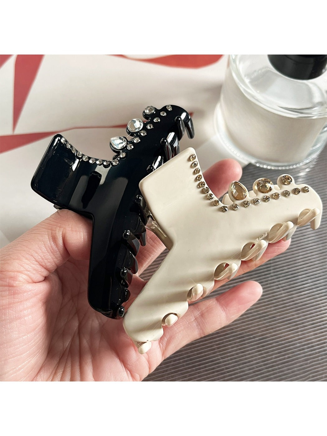 Beau acetate claw clip with rhinestone embellishments on a white background
