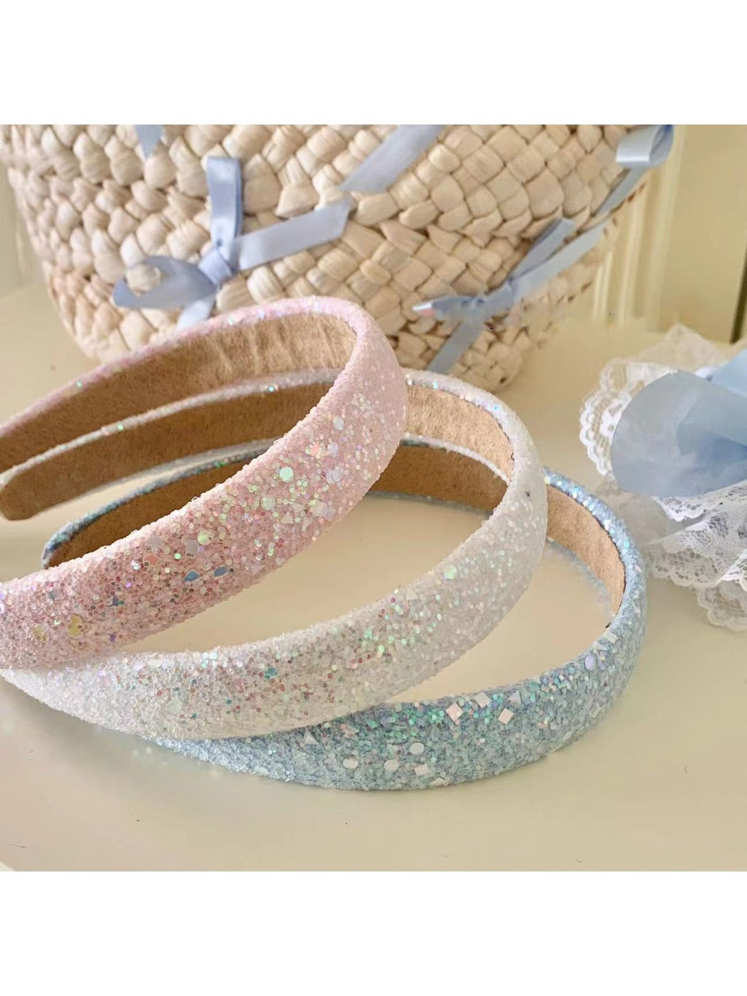 Side view of Gifty Dreamy Sparkly Sweet Headband showing sparkly fabric and bow design