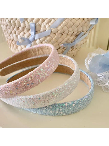 Side view of Gifty Dreamy Sparkly Sweet Headband showing sparkly fabric and bow design