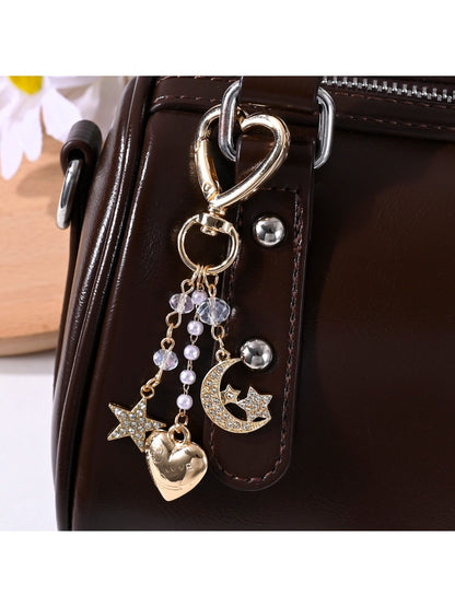 Alloy keychain featuring star, moon, and heart charms on a key ring