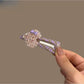 Plaid beaded heart hair clip on a white background showing front view