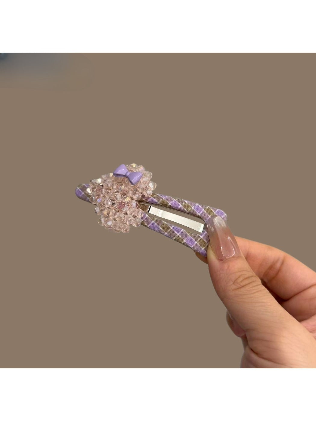 Plaid beaded heart hair clip on a white background showing front view