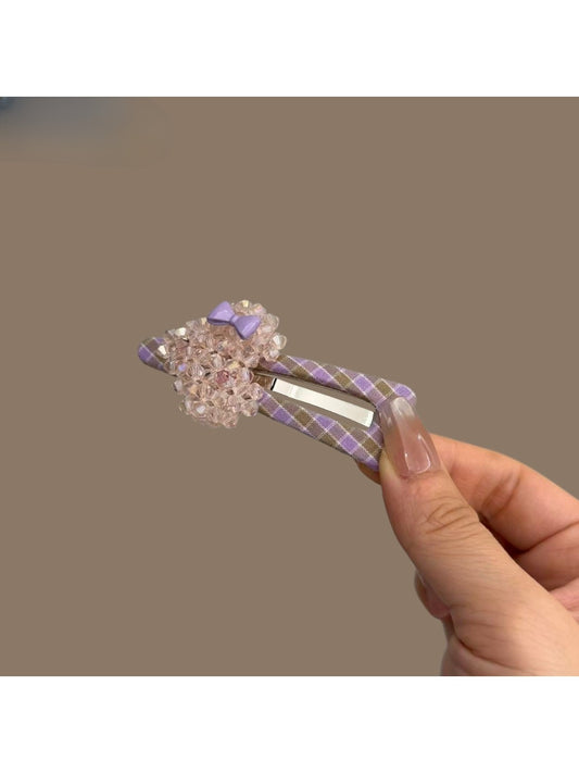 Plaid beaded heart hair clip on a white background showing front view