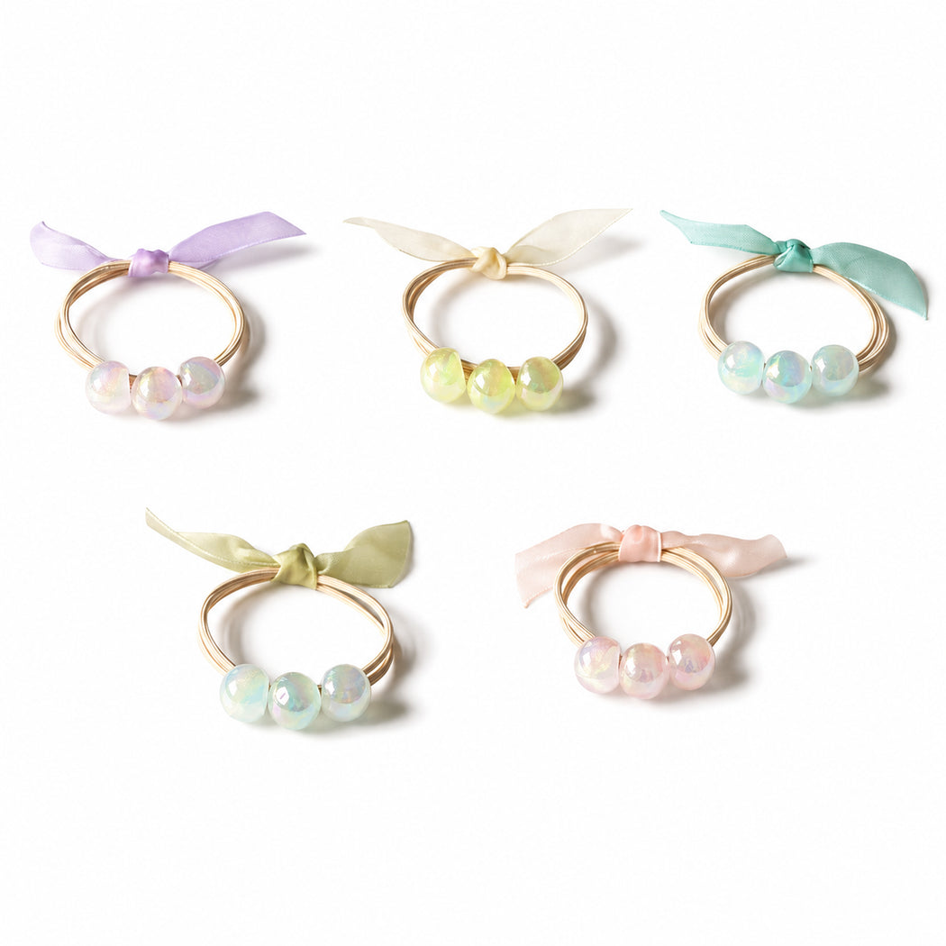 Clean overview of five iridescent bead hair tie variants
