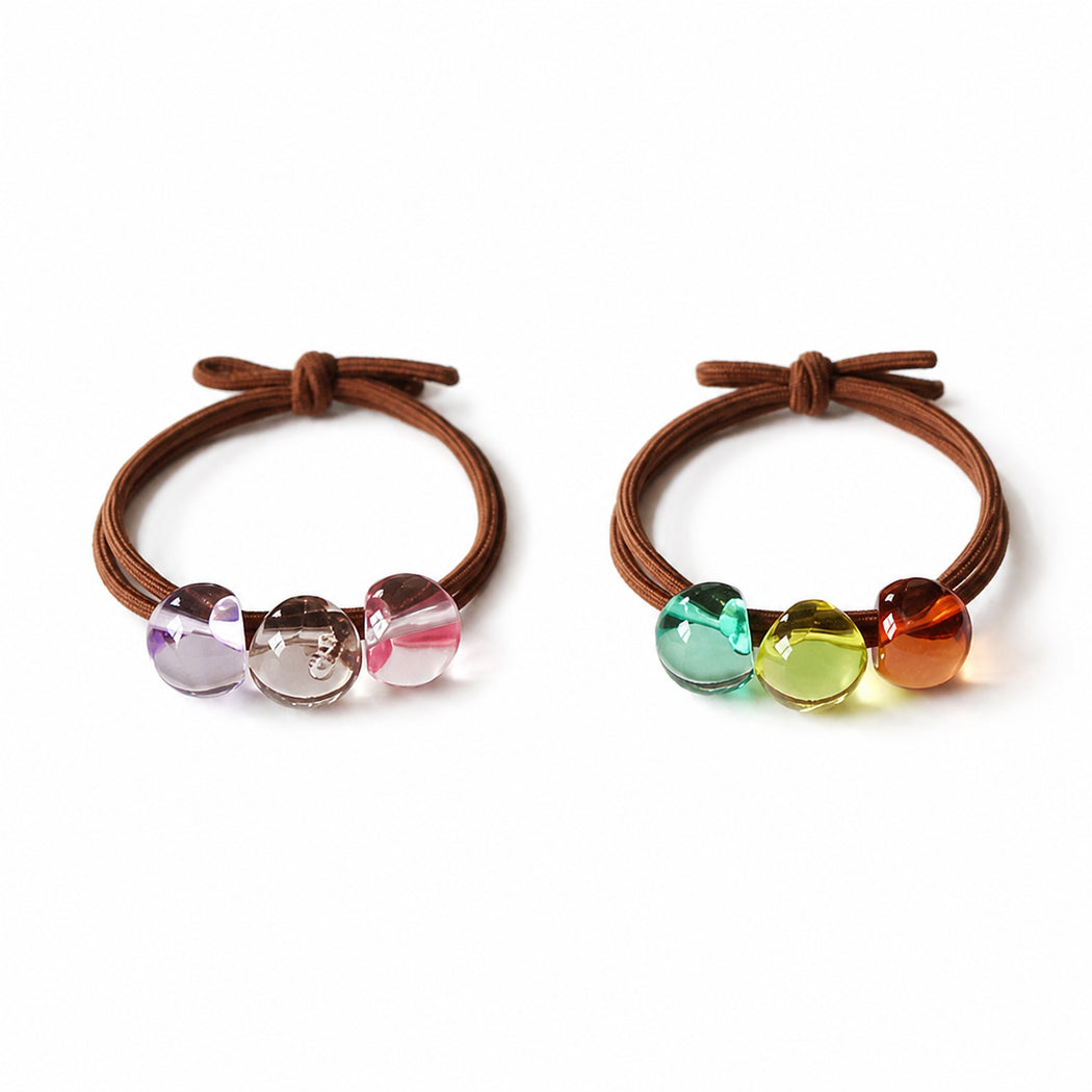 Clean overview of two faceted bead hair tie set variants