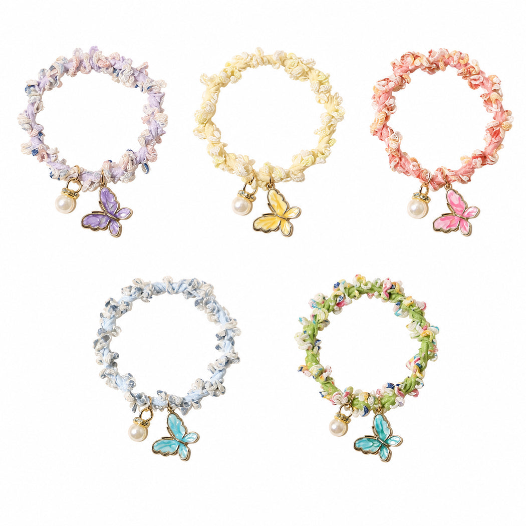 Clean overview of five butterfly pearl hair tie variants