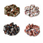 Clean overview of four floral scarf scrunchie variants
