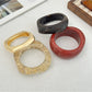 Close-up of Lovra vintage wide irregular shaped bangle bracelet showing texture