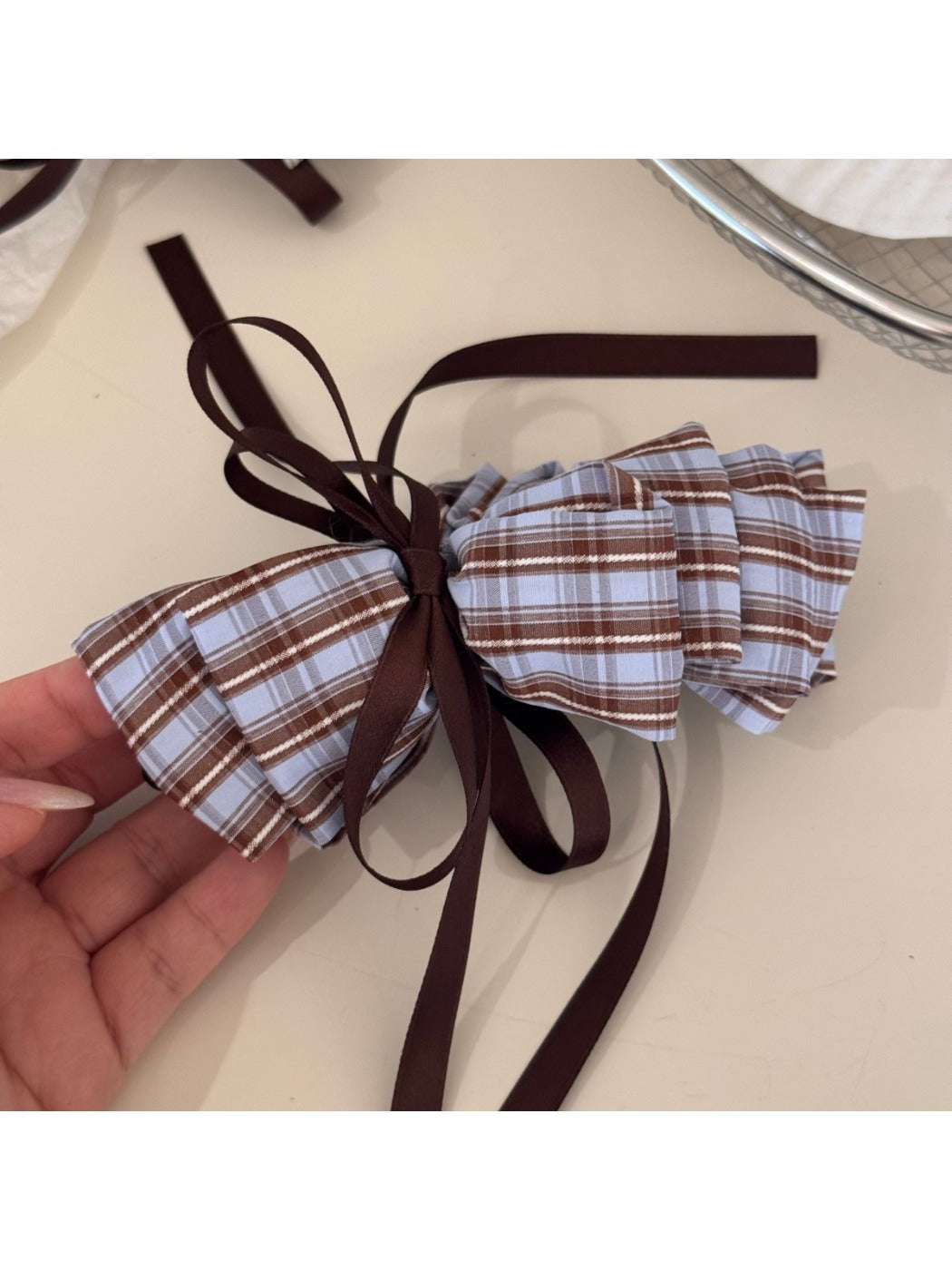 Beau bow hair clip worn in styled hair, highlighting size and shape