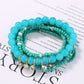 Top view of Lovra rhinestone pendant and colorful beaded bracelet