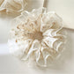 Close-up of Gifty floral print scrunchie showing layered tulle ruffles