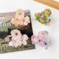 Side view of Beau vintage double flower hair claw clip highlighting the clip mechanism