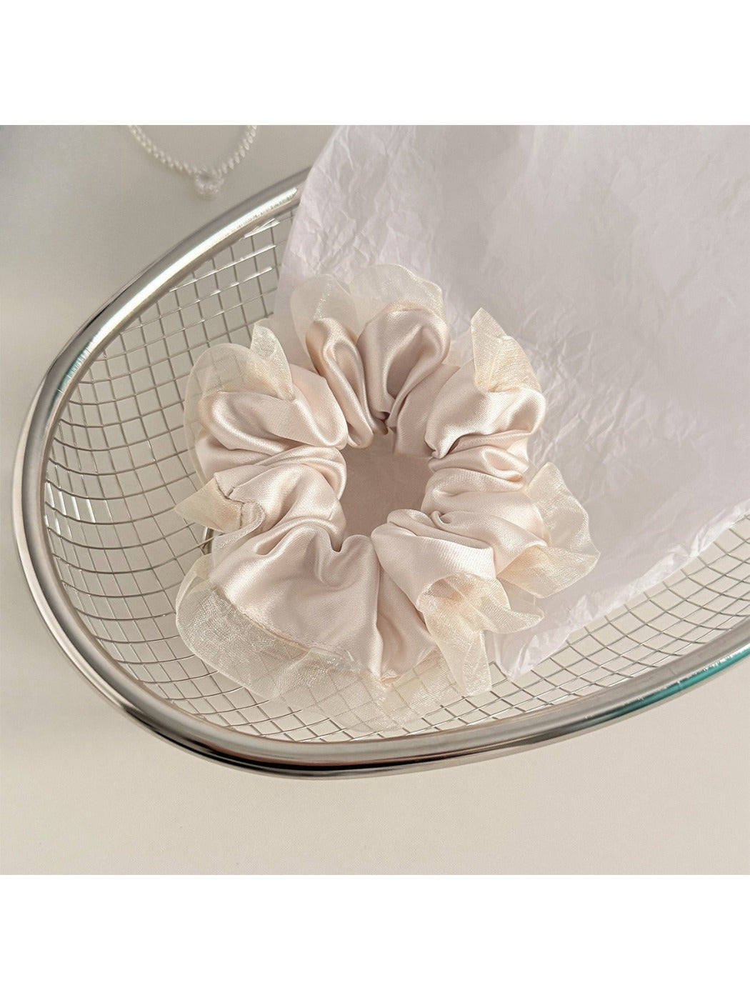 Gifty scrunchie stretched to show elasticity and fabric layers