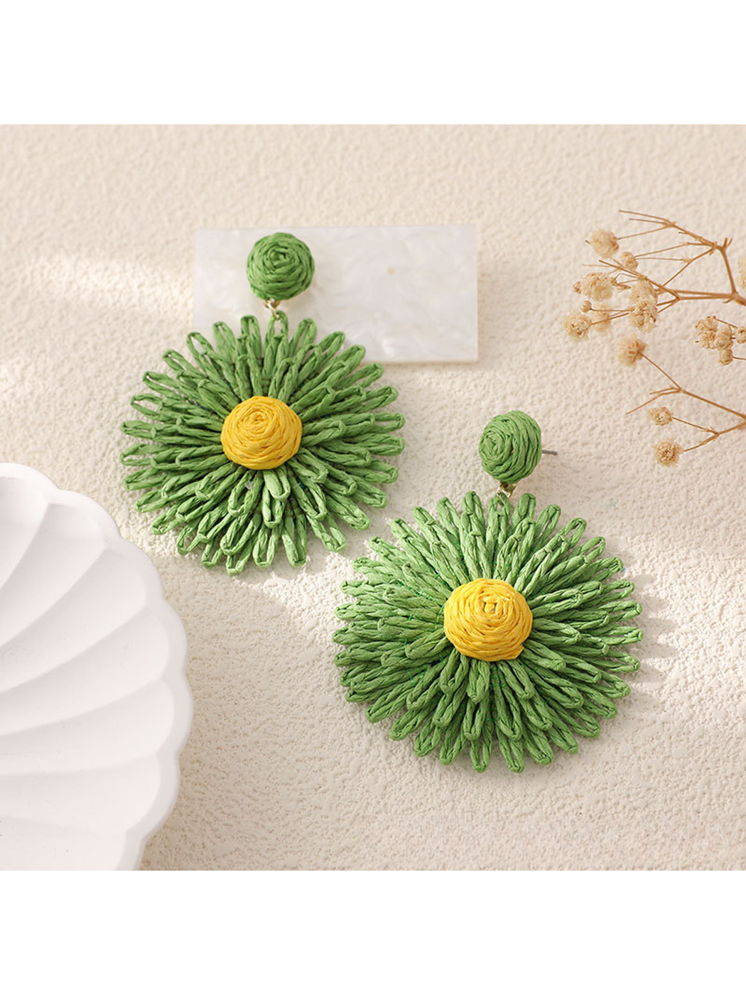 Colorful floral raffia earrings displayed with matching accessories