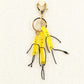 Miniature French fries keychain with yellow fries in a red container