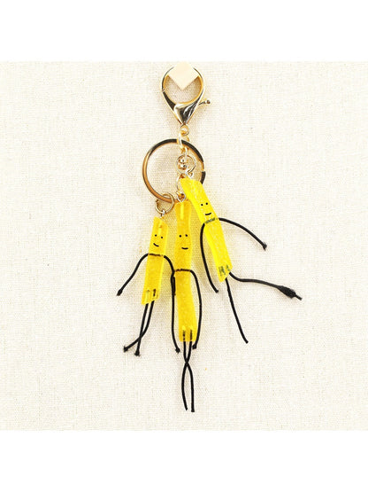 Miniature French fries keychain with yellow fries in a red container
