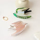 Beau cute little bird shape claw clip in pastel pink on white background