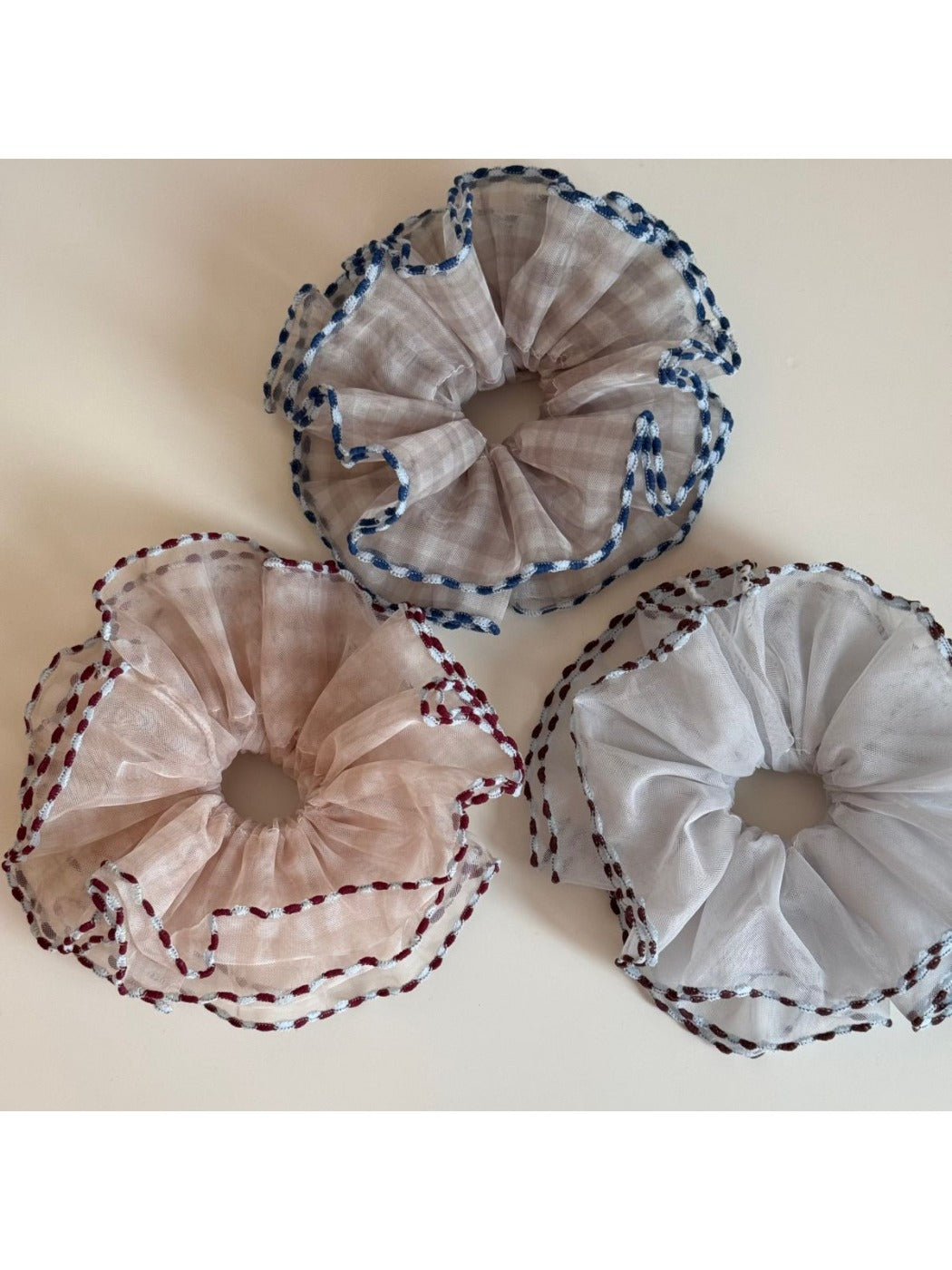 Side view of Gifty color block bound edge tulle scrunchie on a white background
