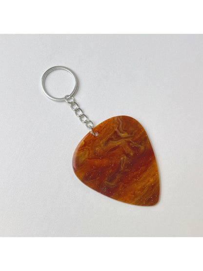 Keypus keychain on a rustic wooden surface with natural light highlighting texture