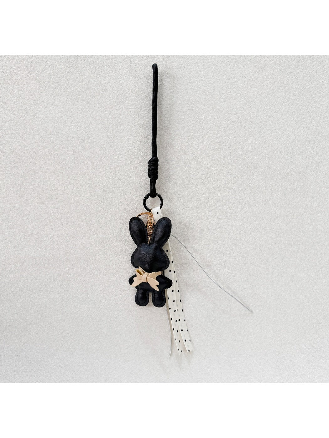 Cartoon bunny keychain displayed on a white background