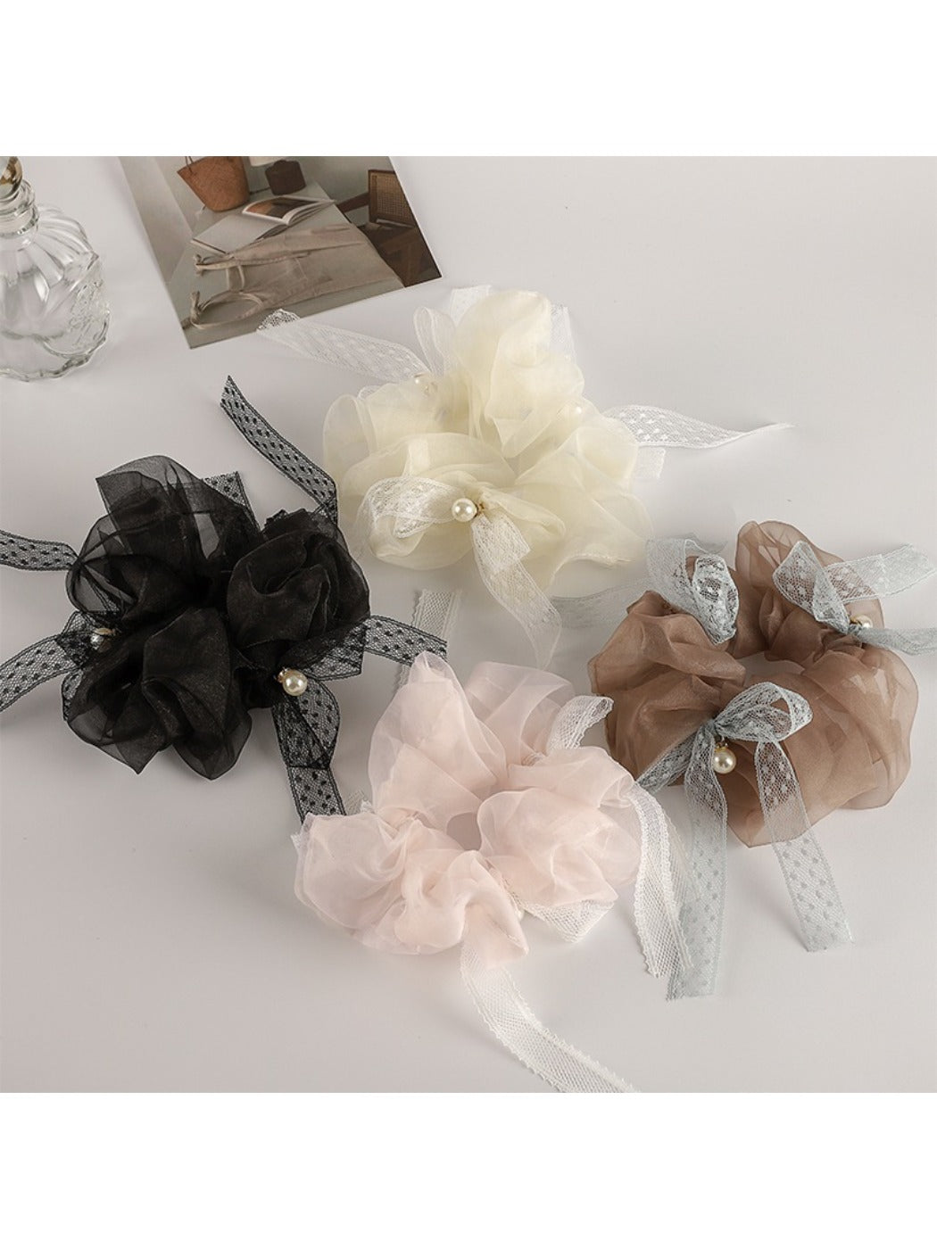 Close-up of Gifty Sweet Bow Accented Ruched Scrunchie in soft pink fabric