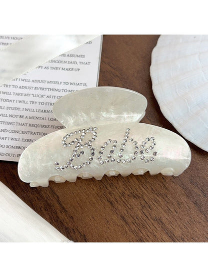 Beau crescent shaped hair claw clip displayed on a white background