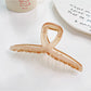 Beau square crisscross hair claw clip in a natural light setting