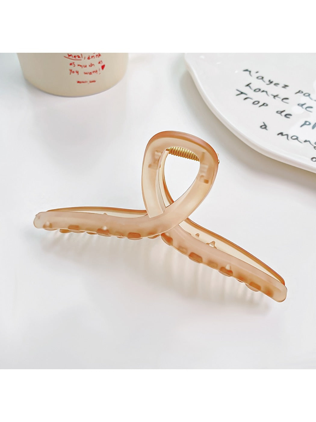 Beau square crisscross hair claw clip in a natural light setting