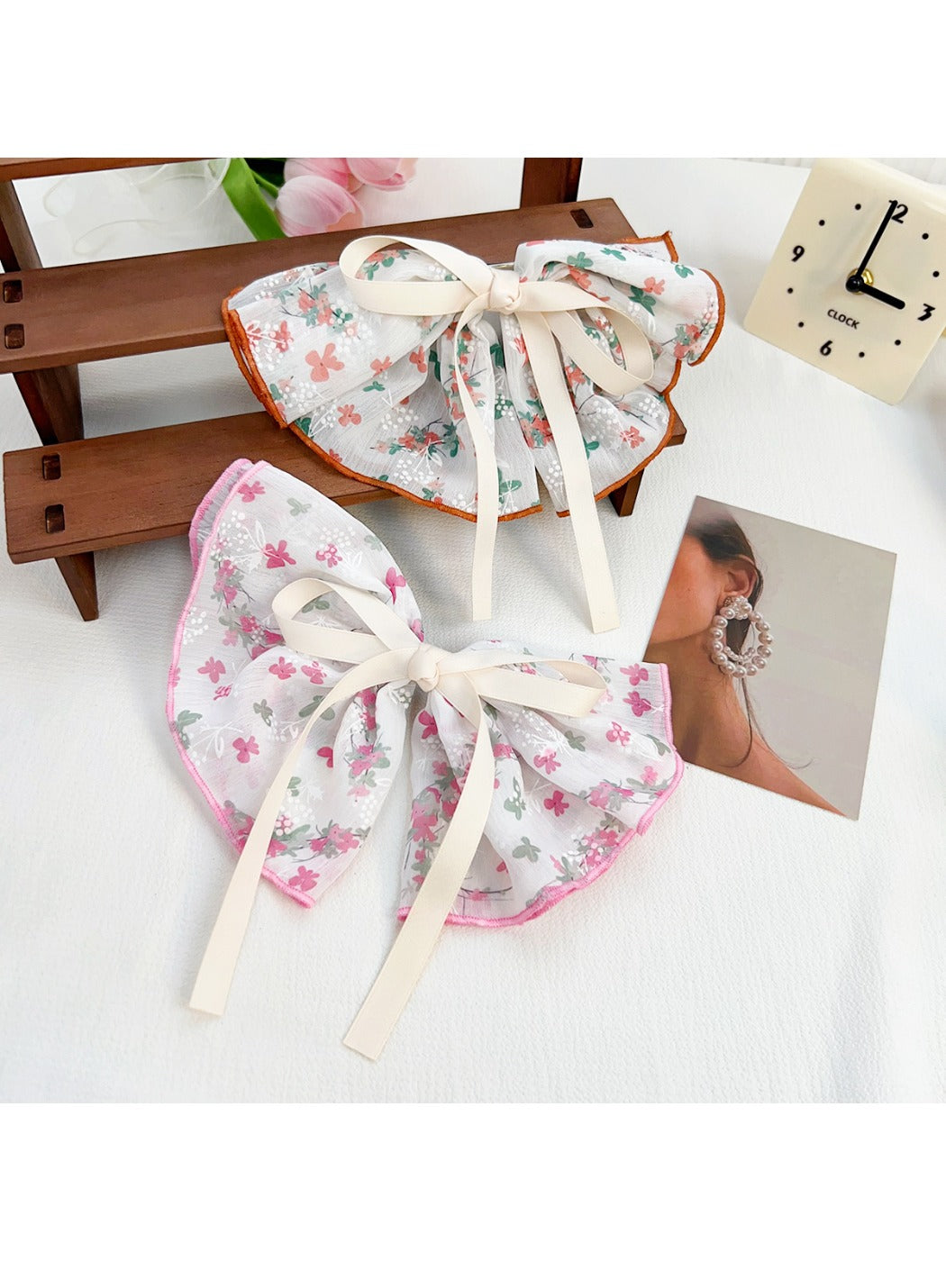 Beau Chic Sweet Bow Hair Clip styled in model's blonde hair against neutral background