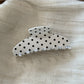 Beau Sweet Polka Dot Stripe Claw Clip resting on fabric surface showing pattern details