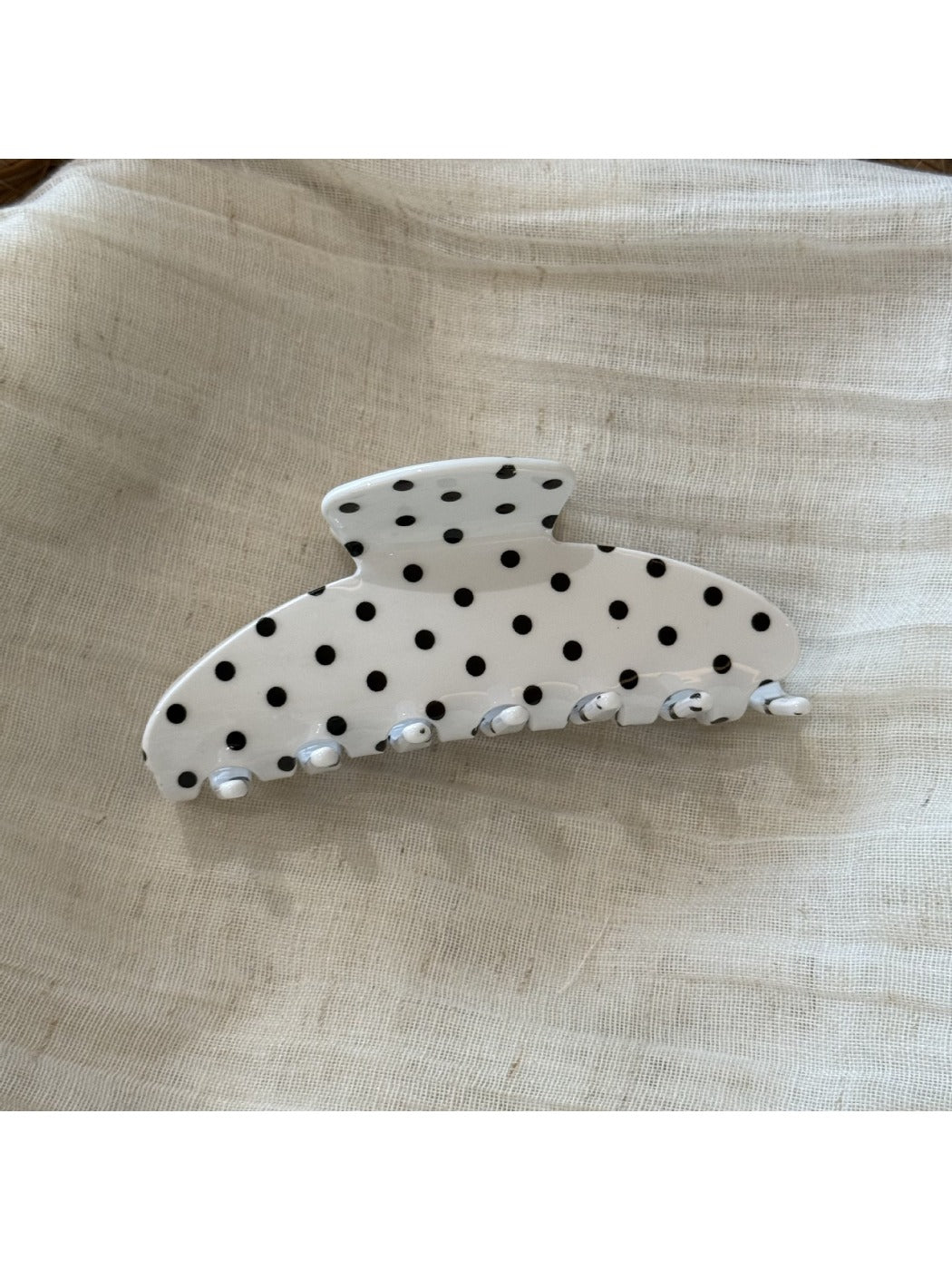 Beau Sweet Polka Dot Stripe Claw Clip resting on fabric surface showing pattern details