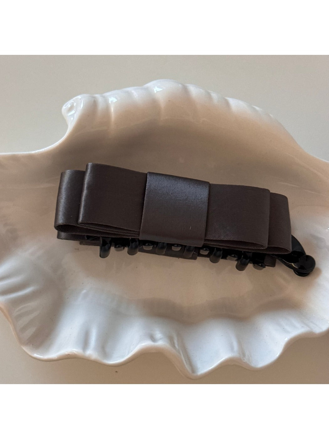 Detailed shot of fabric texture and stitching on Beau vintage bow hair clip