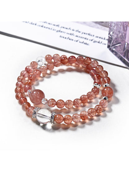 Lovra pink crystal beaded bracelet displayed on a wooden surface with soft lighting