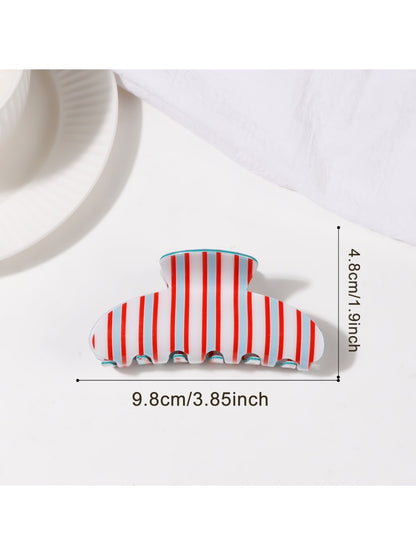 Beau striped half moon claw clip angled to show thickness and colors