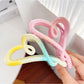 Beau heart shaped claw clip held in hand displaying size and grip
