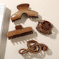 Beau - Glossy PS Curved Hollow Design Claw Clip