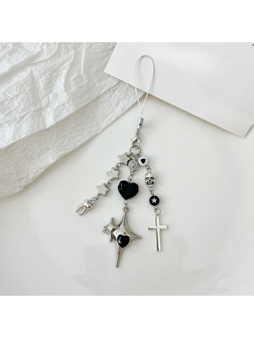 Silver cross keychain displayed in a black gift box with soft lining