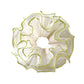 Gifty Natural Misty Mesh Scrunchie styled in a ponytail on a model