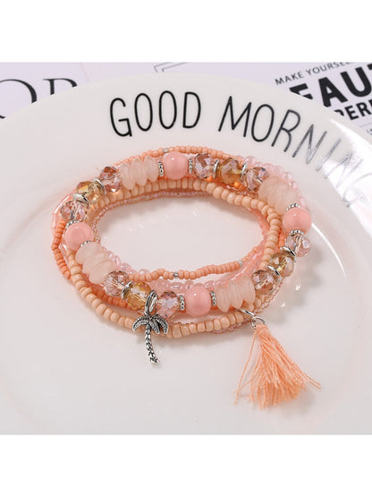 Lovra bracelet styled with casual outfit featuring colorful beads and tassels