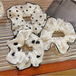 Gifty - Black-Bordered Geometric Luxury Scrunchie