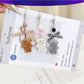 Keypus flocked bear bag charm keychain hanging on a handbag strap
