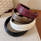 Close-up of Gifty wide edge headband showing smooth texture and stitching details